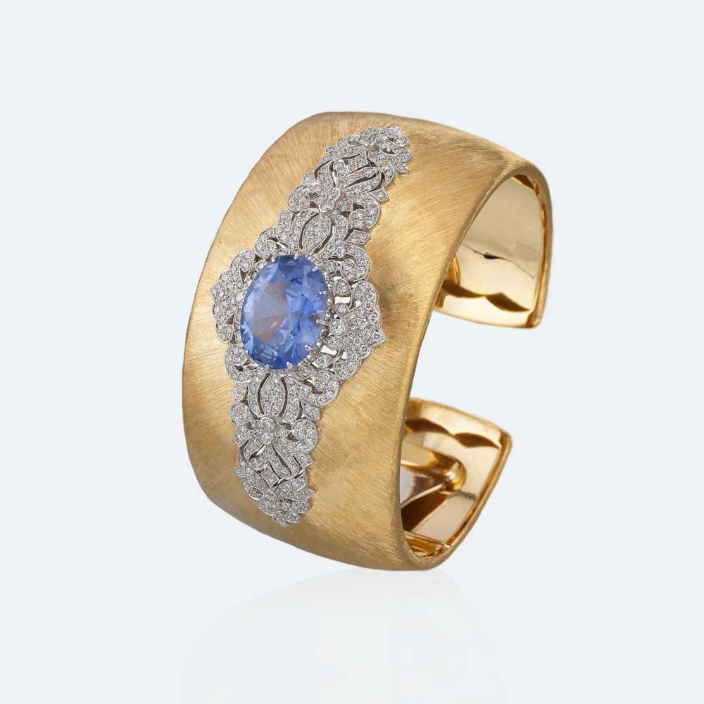 Yellow and white gold with sapphire and diamonds