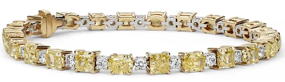 Fancy Intense Yellow Radiant & Cushion Diamond Bracelet in 18k Yellow Gold Unmatched in brilliance, this one-of-a-kind diamond bracelet has twenty-four radiant and cushioned diamonds set in enduring yellow gold, a stunning accent to any ensemble.