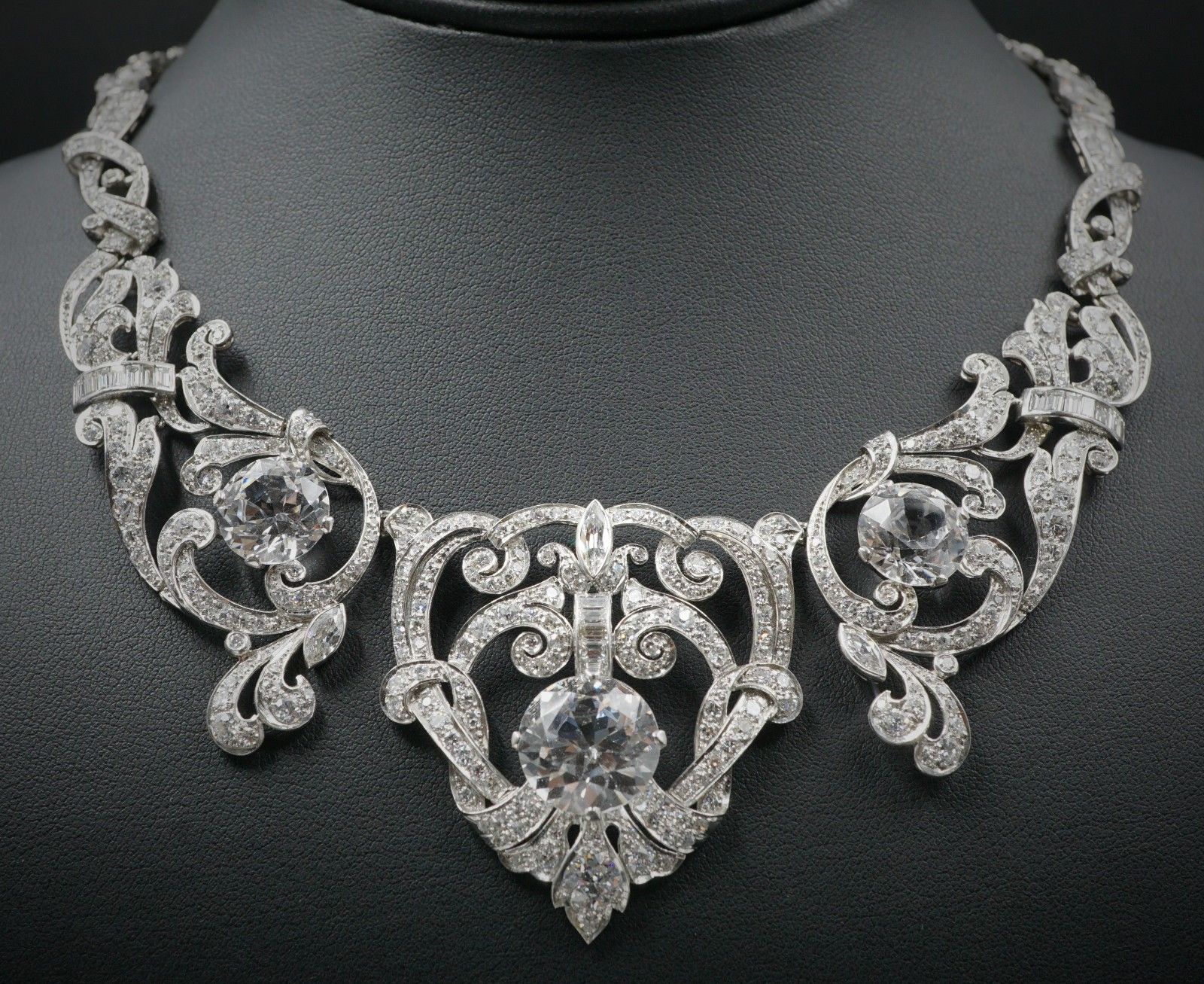 Necklace: ladies platinum Edwardian era Art Deco design open filigree natural diamond and imitation diamond link necklace, fastening with a fold-over locking clasp | 568 diamonds | 12.9 carats | Appraisal: $188,500