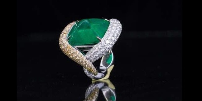 A 16.95 carat Colombian Emerald sugar loaf ring by Smart Arts. 