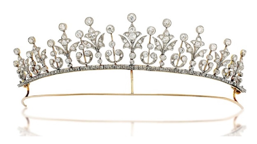 An early-20th-century diamond tiara / necklace. Composed of a graduated series of rose and old-cut diamond millegrain-set foliate motifs alternately set between diamond collet accents raised on knifebar connections, with rose-cut diamond line below and similarly-set detachable backchain, mounted in platinum and gold, circa 1900. As a necklace 37 cm long, original case. Sold for £15,000 on 27 November 2013 at Christie’s in London