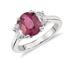 Oval Ruby and Half-Moon Diamond Three-Stone Ring in Platinum (3.04 ct center)     Classic and beautiful, this ruby and diamond ring features an oval ruby nestled between two brilliant half-moon diamonds set in enduring platinum.  