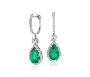 Pear Shape Emerald and Diamond Drop Earrings in 18k White and Yellow Gold (3.86 ct) (10.6x7mm)     Graceful and sophisticated, these dramatic drop earrings feature stunning, vibrant emeralds set in 18k white and yellow gold, ideal for special occasions. Purchase is accompanied by gemstone certification.  