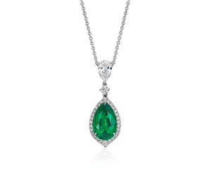 Pear-Shape Emerald and Pavé Halo Diamond Drop Pendant in 18k White Gold (2.71 carats)     Exquisite elegance, this one-of-a-kind gemstone and drop diamond pendant showcases a vibrant 2.71 carat emerald surrounded by pavé-set diamonds set in 18k white gold with a matching cable chain necklace. Emerald accompanied by gemstone report. 