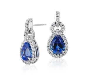 Pear Shape Tanzanite and Diamond Link Earrings in 18k White Gold (6.68 ct tw) (11x8mm)     The brilliance of color is captured in these tanzanite and diamond earrings featuring vibrant pear shape tanzanite gemstones framed by round diamonds in 18k white gold.  
