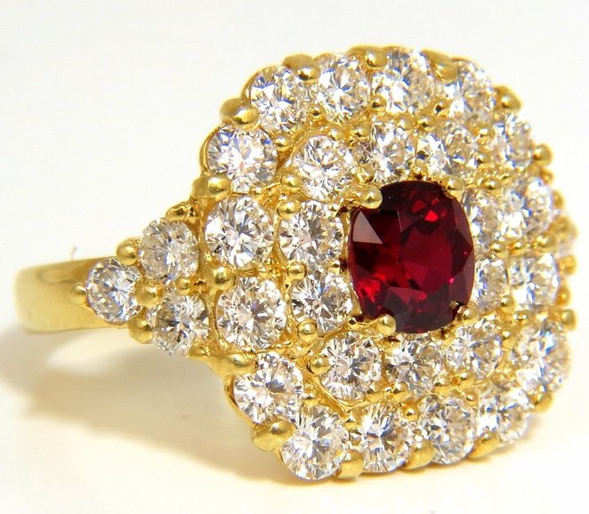 Cluster Sparkles Mastered. 1.47ct. Natural GIA "No Heat" Ruby Diamonds ring. Ruby, Excellent clean clarity vivid red color. Brilliant sparkles from all angles Pristine Transperency GIA Certified (Report Attached) 3.32ct side diamonds Vs-2 Clarity, F/G-color 18kt. yellow gold 13.5 grams. Deck of ring: .71 X .72 Inch. depth of ring: .32 inch current ring.