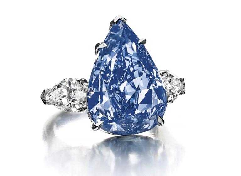 At a Christie's auction, a 13.22-carat pear-shaped blue diamond sold for $23.8 million