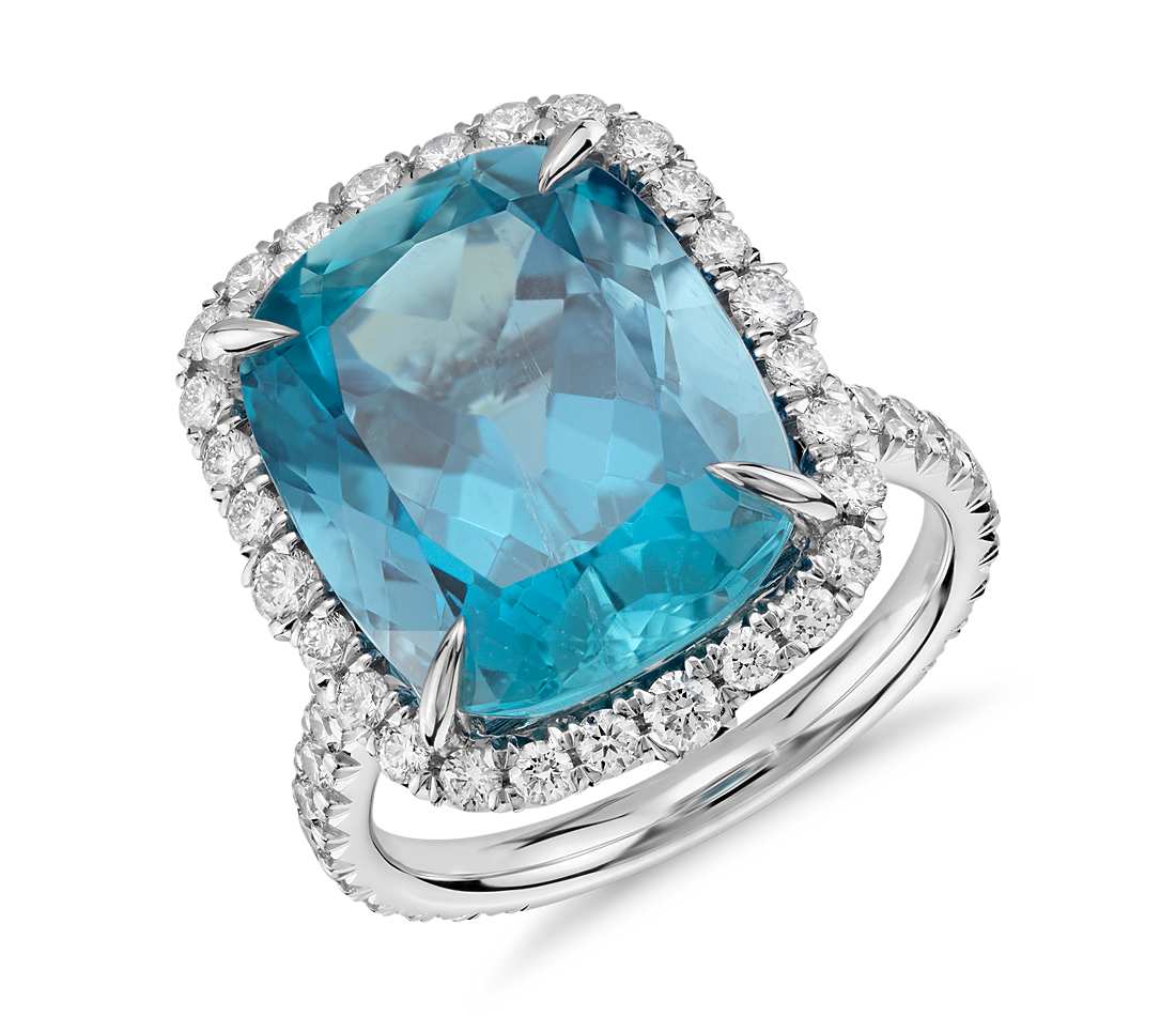 Blue Nile Aquamarine and Diamond Ring in 18k White Gold (9.26 ct center) Truly unique, this gemstone ring features a vibrant 9.26ct cushion-shaped aquamarine surrounded by sparkling micropavé-set diamonds framed in 18k white gold. 