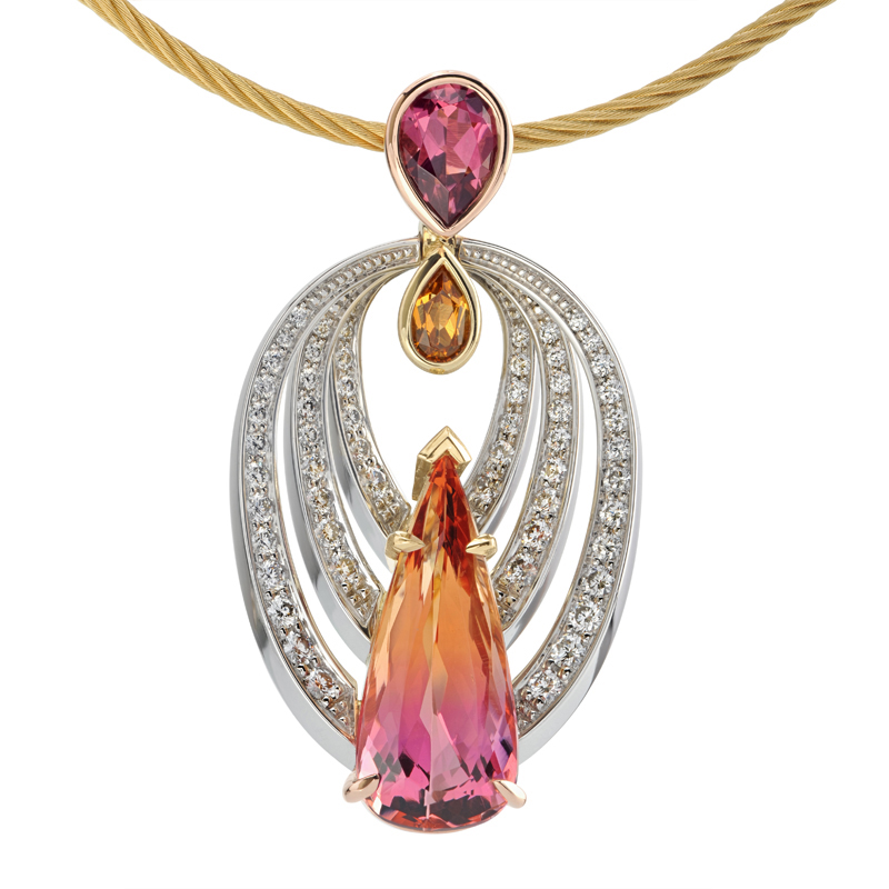  5.74ct Bi-Color Topaz set in Platinum, 18k Rose and Yellow Gold accented by a Pear Shaped Garnet and Tourmaline and Round Brilliant Cut Diamonds.