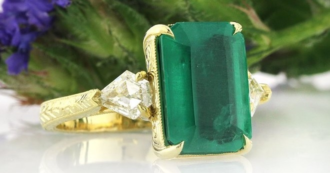 A Stunning 6.35ct Emerald and Diamond Three-Stone Ring