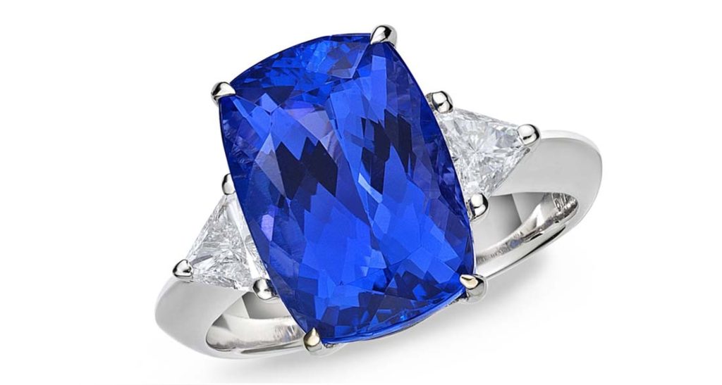 TanzaniteOne tanzanite engagement ring with a rare deep blue-violet 6.72ct cushion-cut tanzanite set in white gold, flanked by trillion-cut diamonds ($4,800).