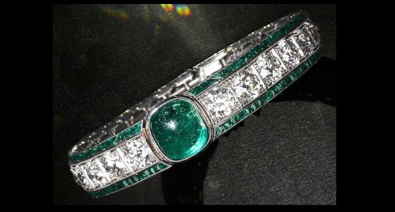 Tiffany & Co. - An Art Deco emerald and diamond bracelet, circa 1925.