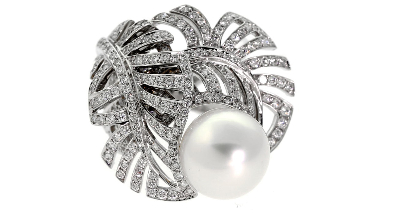 A magnificent authentic Chanel pearl and diamond ring featuring 1.72ct of the finest round brilliant cut diamonds set in 18k white gold.