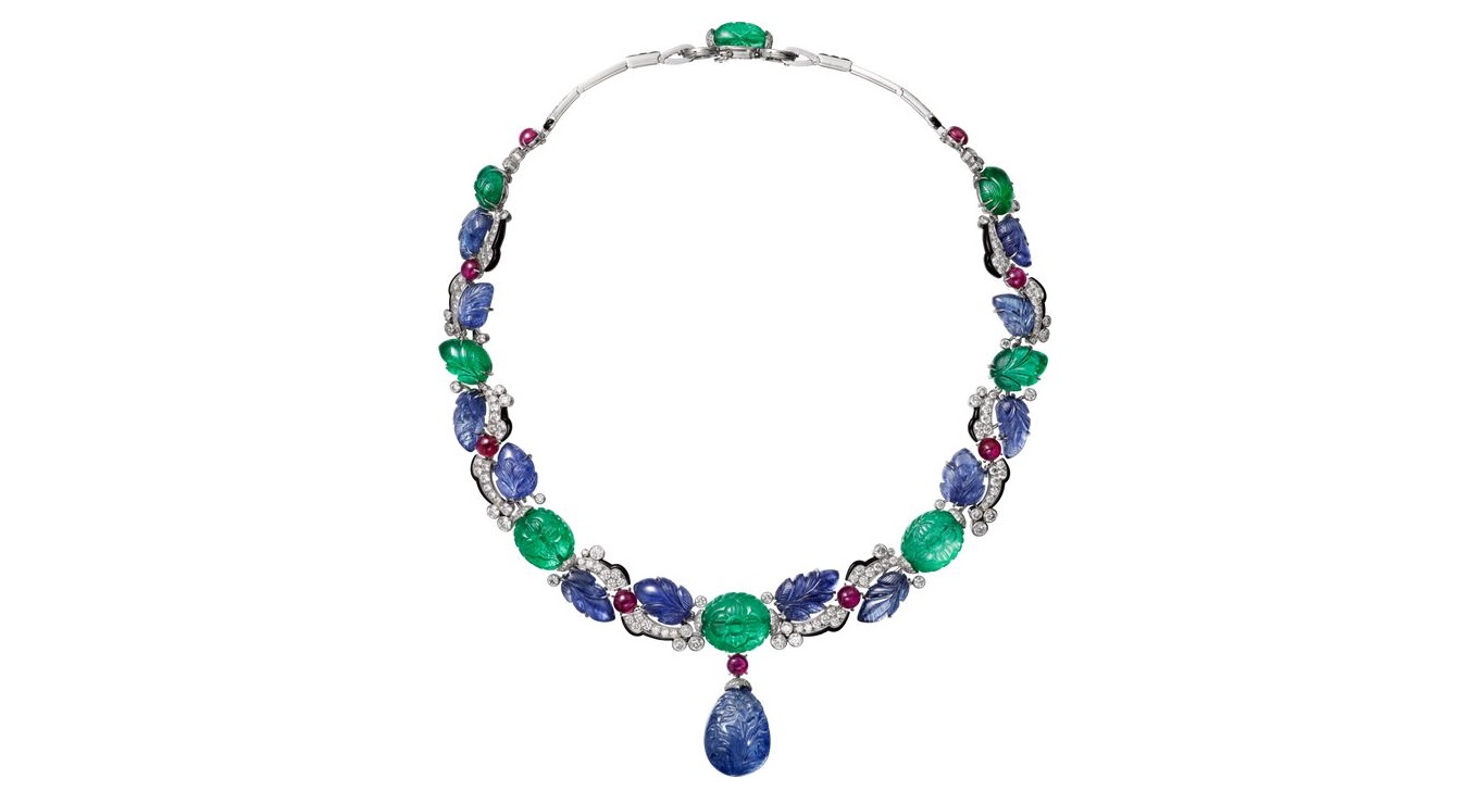 CARTIER. Necklace - platinum, one 42.77-carat carved sapphire from Ceylon, carved sapphires and emeralds, cabochon-cut rubies, calibrated sapphires, onyx, brilliant-cut diamonds. The carved sapphire drop is removable.