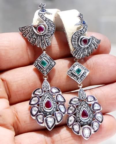 The earrings drop 2.8 inches and are 0.9 inches wide. These weigh 19.3 grams.