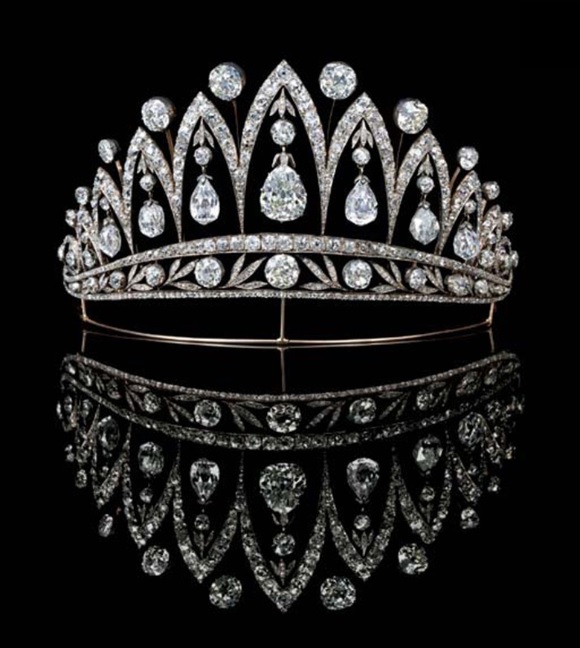 A magnificent antique diamond tiara, by Fabergé. Designed as a series of graduated old-cut diamond arches with knife-edge collet spacers, the central pear-shaped diamond flanked by three briolette and one old-cut diamond, each with diamond collet and leaf surmount to the foliate band, on gold wire frame, mounted in silver and gold, circa 1890, 13.2 cm wide, with Russian assay marks for gold. Sold for £1,050,400 on 13 June 2007 at Christie’s in London