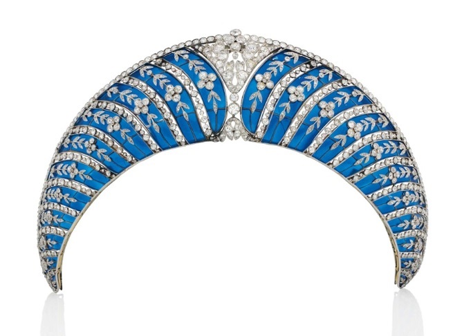 A Belle Époque enamel and diamond tiara, by Chaumet. Of kokoshnik design, composed of a series of graduated translucent royal blue plique-à-jour enamel curved panels, each overlaid with old-cut diamond trailing forget-me-not floral motifs, interspersed with collet-set diamond lines, to the cushion-shaped diamond openwork cartouche centre and similarly-set upper border, circa 1910, mounted in platinum and gold, with a later fitted case. Sold for CHF 677,000 on 10 November 2015 at Christie’s in Geneva