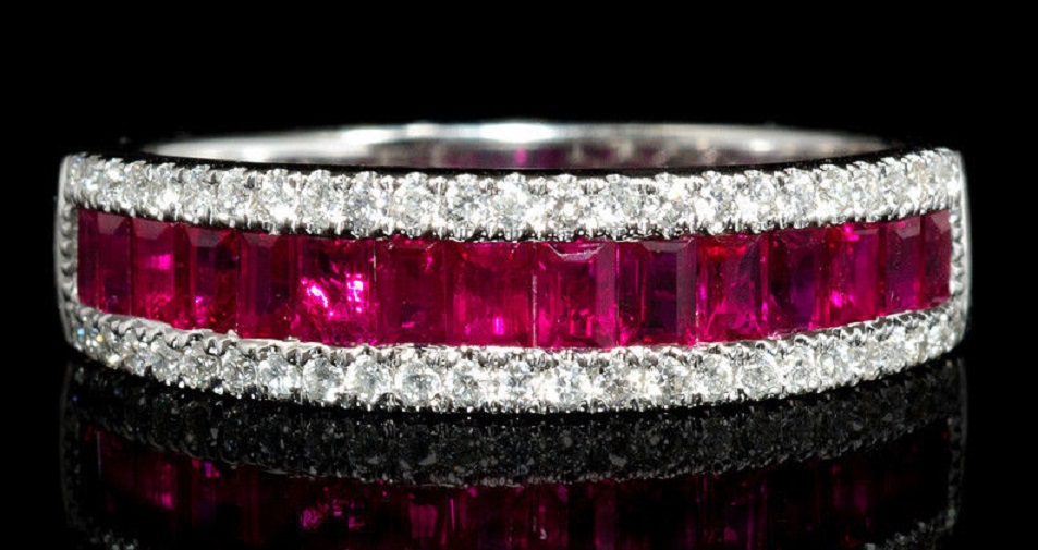 Diamond and Ruby 18k White Gold Ring This stylish 18k white gold ring, features 50 round brilliant cut white diamonds, of F color, VS2 clarity, with excellent cut and brilliance, weighing .21 carat total with 17 rubies of exquisite color, weighing 1.02 carats total.